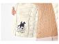 Une veste blanche U.S. Grand Polo Equipment & Apparel avec un logo de cheval.