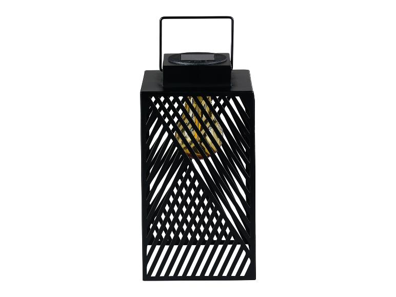 Lanterne solaire noire à motif géométrique, éclairage LED intégré.