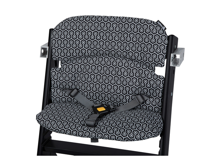Une chaise haute noire avec un motif hexagonal de Safety 1st.