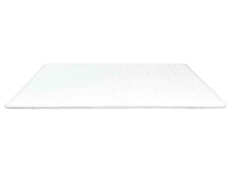 Un matelas blanc avec un dessus matelassé.