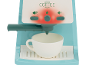 Machine à café jouet turquoise avec tasse blanche et lumières rouges