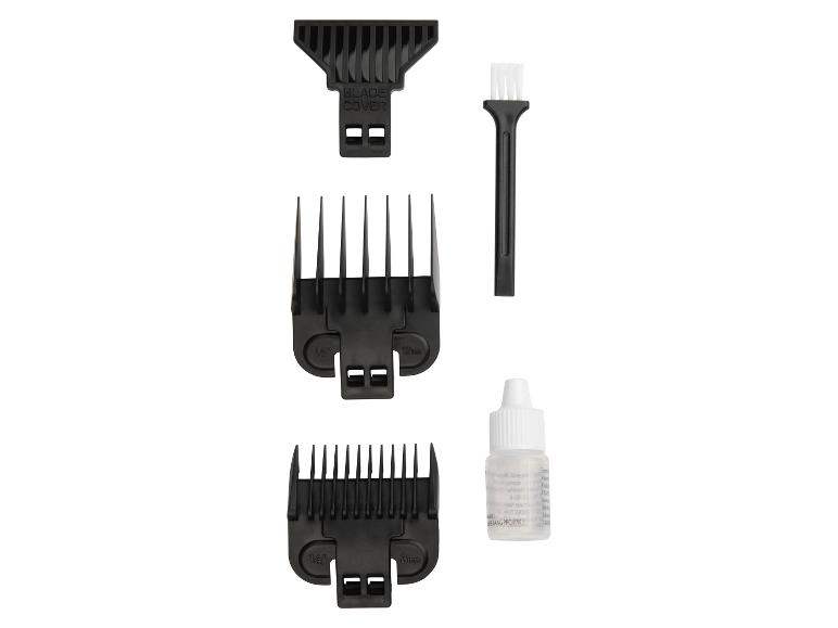 Accessoires de tondeuse à cheveux : cache-lame, brosse de nettoyage, deux sabots et huile.