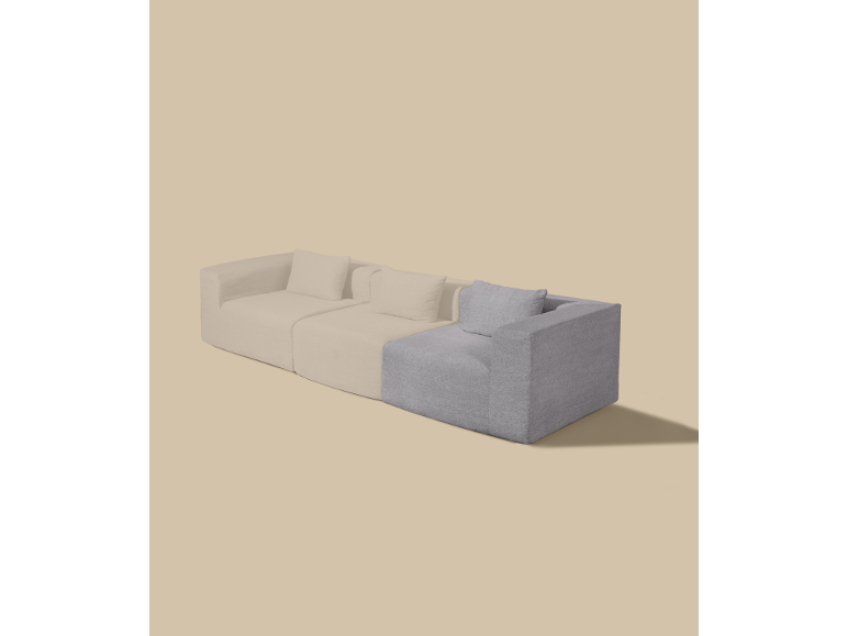 Canapé modulable avec sections beige clair et grises sur fond beige.