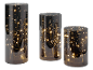 Trois vases en verre fumé avec des guirlandes lumineuses LED à l'intérieur.