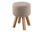 Un pouf rond avec un revêtement en fourrure douce et des pieds en bois.