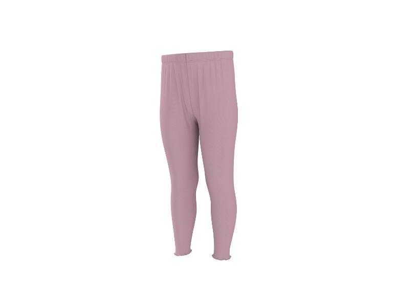 Legging femme rose clair avec taille élastique et ourlets ondulés.