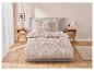Parure de lit fleurie beige et blanche.