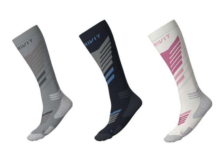 Chaussettes de ski techniques unisexes premium CRIVIT en gris, noir et blanc avec touches colorées.