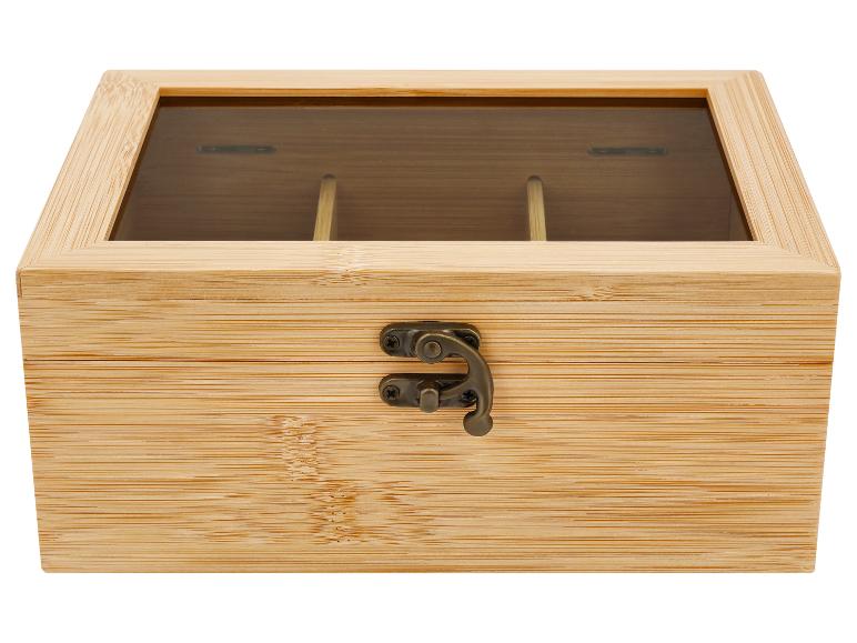 Boîte à thé en bambou avec couvercle transparent et fermoir métallique.