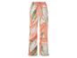 Pantalon fluide à fleurs corail et vert clair.