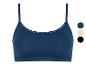 Un soutien-gorge bleu marine avec des bretelles fines et de la dentelle sur le dessus.