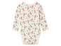 Un body bébé blanc à manches longues avec un motif floral.