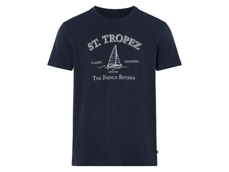 Un t-shirt bleu marine avec un motif St. Tropez avec un bateau.