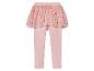 Leggings roses avec une jupe en tulle à étoiles et cœurs.