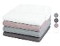 Lot de draps-housses unis dans des tons neutres.