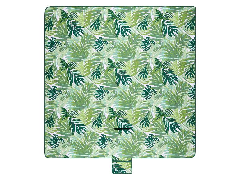 Couverture de pique-nique verte à motif de feuilles tropicales.