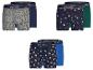 Trois paquets de deux boxers pour hommes avec des motifs de Noël.