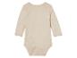 Body bébé beige à manches longues.