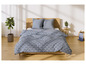 Un lit avec une couette bleue à motif géométrique et des oreillers assortis.