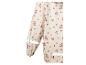 Imperméable crème à motif floral rose et bandes réfléchissantes.