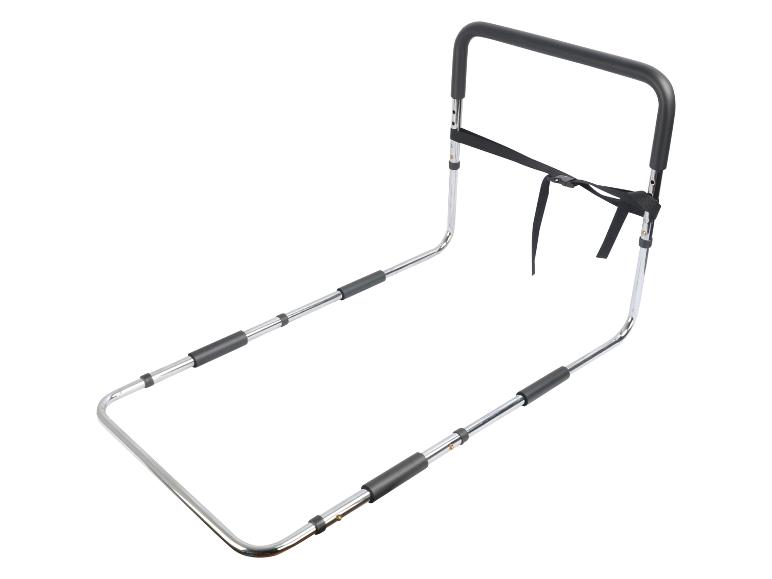Barre d'appui de lit en métal chromé avec poignée noire et sangle de fixation.
