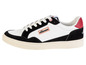 Sneakers Ellesse blanches et noires avec une semelle beige.