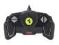Une télécommande noire avec le logo Ferrari pour une voiture jouet Rastar.