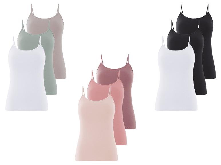 Un ensemble de trois tops à bretelles fines en blanc, noir et beige.