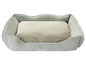 Un lit pour chien gris de Zoo'n Fair avec un coussin moelleux.