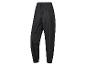 Pantalon de pluie noir avec taille élastique.