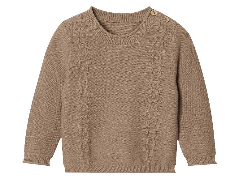 Pull en maille beige avec un motif torsadé
