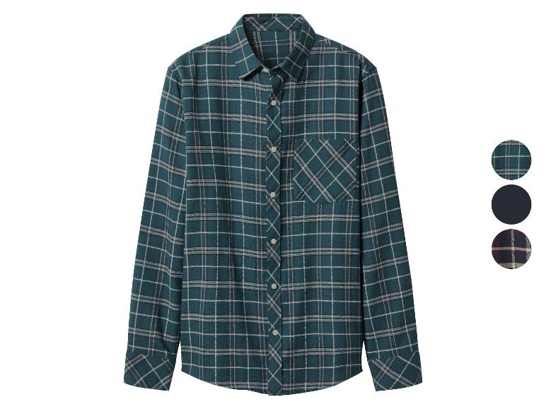 Une chemise à carreaux verte et blanche à manches longues avec une poche poitrine et des boutons.