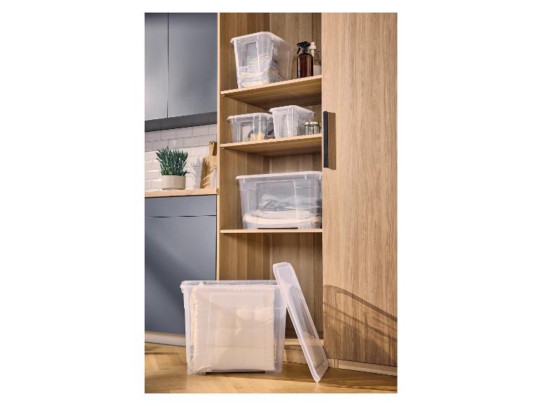 Boîtes de rangement W5 avec couvercle dans une armoire en bois.