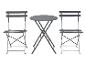 Une table ronde de bistrot avec deux chaises assorties