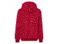Un sweat à capuche rouge avec un motif de flocons de neige.