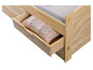 Un lit en bois avec un tiroir contenant un coussin.