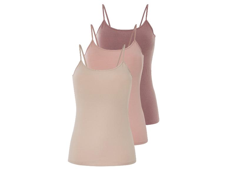 Trois débardeurs unis en beige, rose et rose foncé.