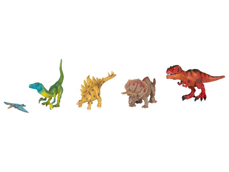 Ensemble de dinosaures jouets comprenant un T-Rex, un Triceratops, un Stégosaure, un Vélociraptor et un Ptérodactyle.