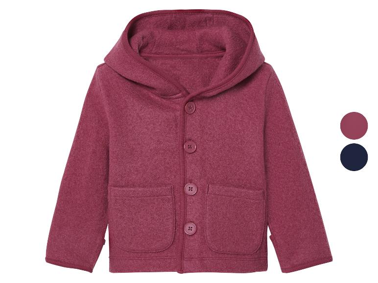 Veste polaire rose à capuche pour enfant.