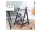 Une chaise haute Stokke Tripp Trapp grise avec un coussin blanc et une table
