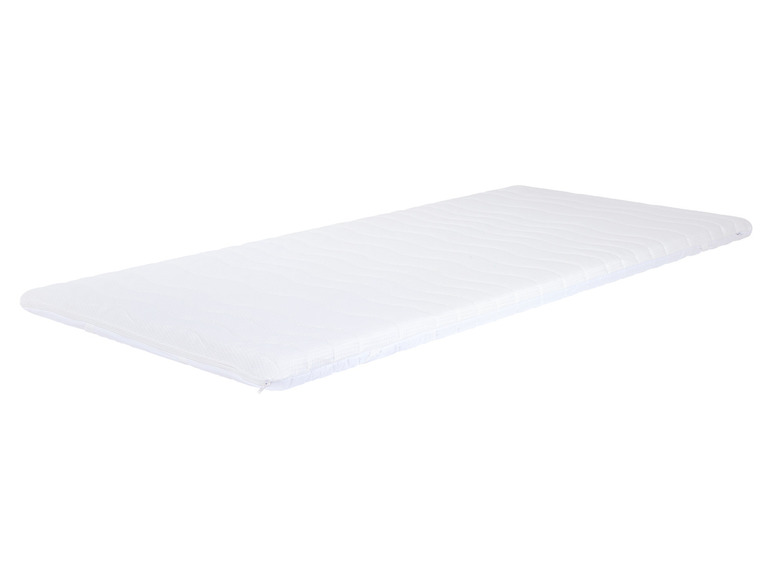 Un matelas blanc avec un motif rayé.