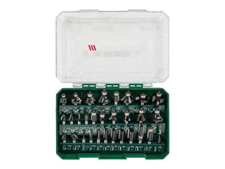 Ensemble de fraises de défonceuse dans une boîte verte, avec diverses formes et tailles