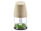 Un mini hachoir SilverCrest beige avec des herbes hachées.