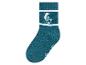 Des chaussettes vertes avec un motif de Schtroumpfs.