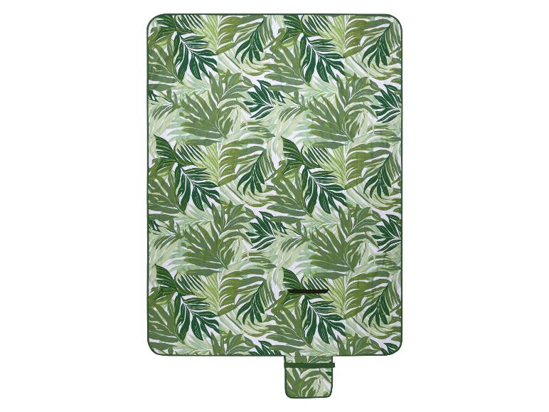 Couverture de pique-nique avec un motif de feuilles tropicales vertes et une petite poche attachée.