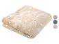 Douce couverture étoilée beige.