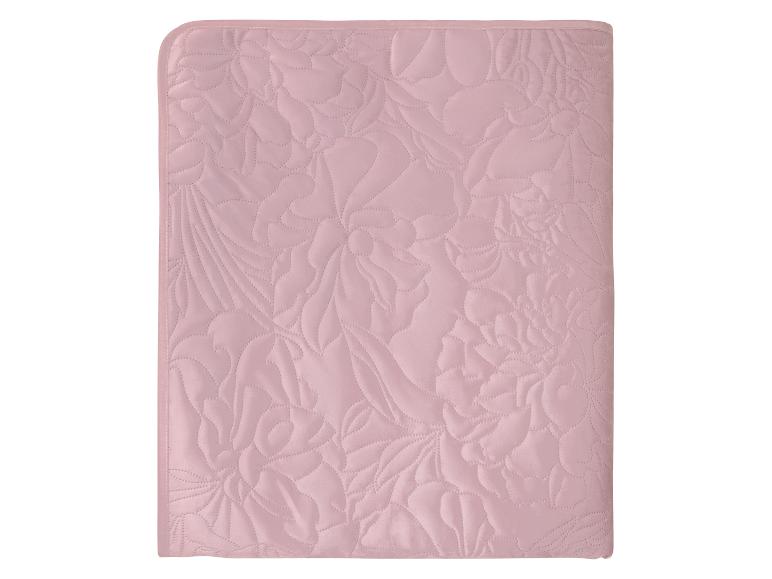 Couverture matelassée rose pâle avec motif floral
