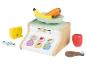 Jouet en bois en forme de balance avec des éléments supplémentaires tels que : banane, carotte, fromage, poisson, poulet et pomme.