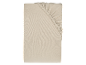 Drap-housse beige en coton.