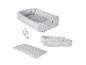 Nid de bébé gris matelassé qui se déplie en matelas, avec une flèche montrant la transformation.